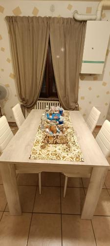 a dining room table with a table cloth on it at Appartamento Beatrice in Villanova dʼAsti