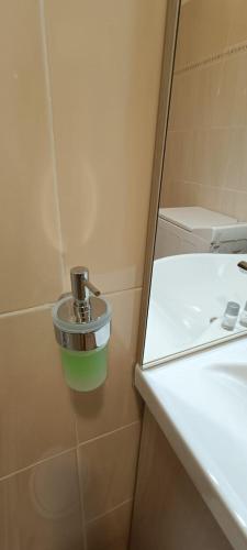 a bathroom with a sink and a faucet at Appartamento Beatrice in Villanova dʼAsti