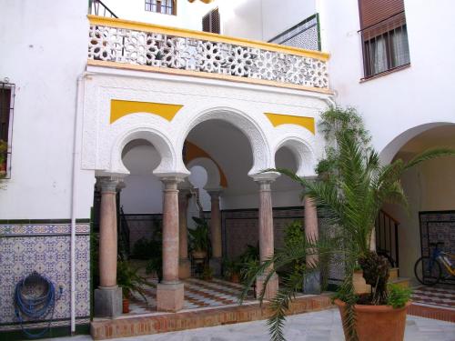 a building with arches and a balcony at SunShine Templo Romano in Córdoba