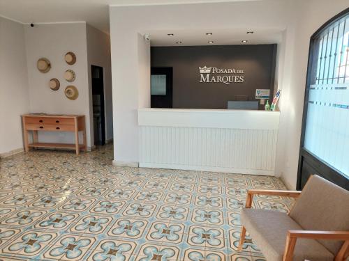 a lobby with a waiting room with a cash register at Posada del Marques Salta in Salta