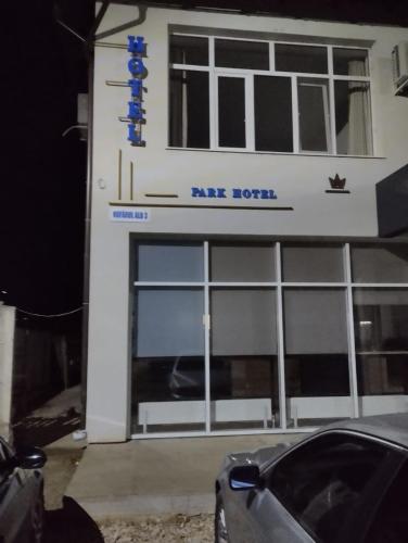 a car parked in front of a building with a rifle hotel at PARK-hotel in Cahul
