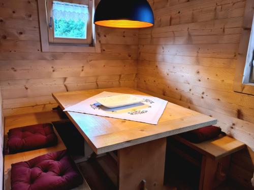 a small room with a wooden table and chairs at Chalet Camporosso in Camporosso in Valcanale
