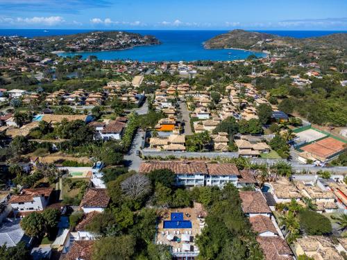 an aerial view of a town with houses and the ocean at Hotel Miratlantico Búzios in Búzios