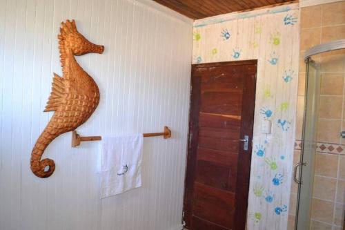 a seahorse on the wall of a bathroom at Mozambique,Inhambane,Barra -Entire Beach House in Inhambane