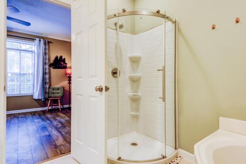 a shower with a glass door in a bathroom at Albatross in Little River