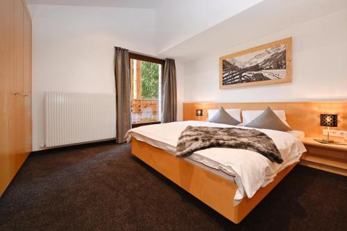 Postel nebo postele na pokoji v ubytování Apartment Marent Garten Chalet