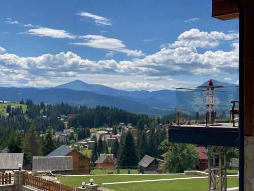 a view of the mountains from the balcony of a house at Високий Перевал, Bukovel in Yablunytsya