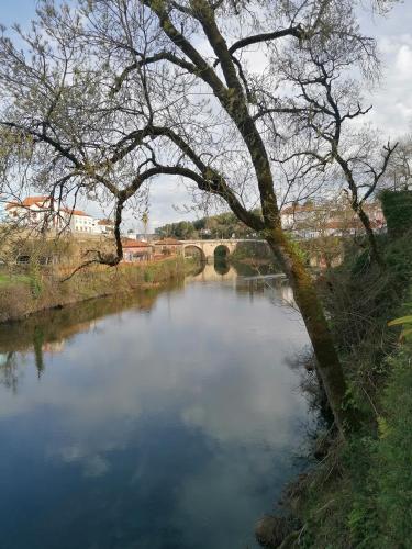 a view of a river with a bridge in the background at Villa Alva Guest House in Coja