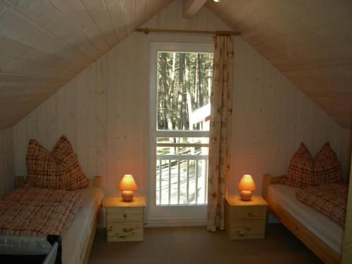 Postel nebo postele na pokoji v ubytování Baabe-Strandhaus