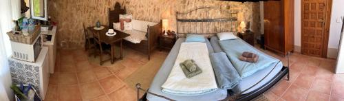 a bedroom with a large bed in a room at Finca Es Velar in Santanyi