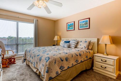 a bedroom with a bed and a window at Bay Oaks 75 in Siesta Key