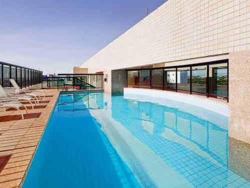 Πισίνα στο ή κοντά στο Lindo Flat Part Grand Mercure Varanda aconchegante