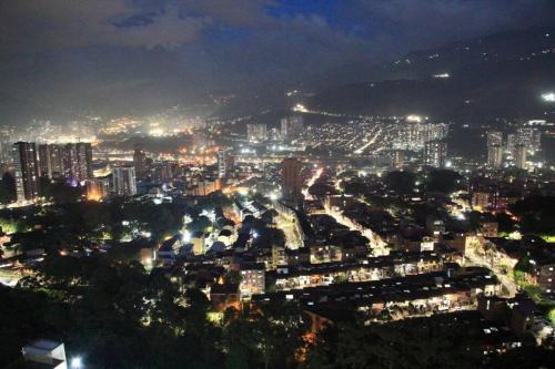 a view of a city at night with lights at New Lovely 3 bedroom condo with an AWESOME view! in Bello