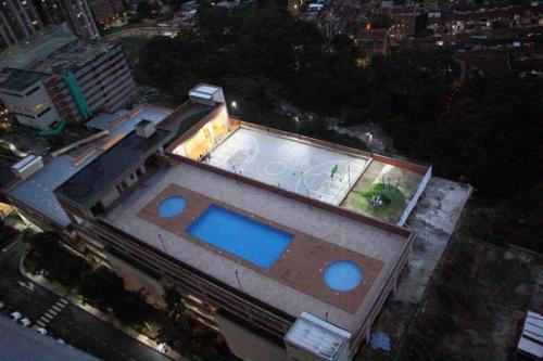 a house with a swimming pool on top of it at New Lovely 3 bedroom condo with an AWESOME view! in Bello