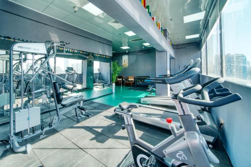a gym with two treadmills and a treadmill at Guangzhou Easun Guotai hotel in Guangzhou