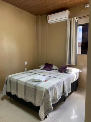 Una cama o camas en una habitación de HOTEL LISBOA
