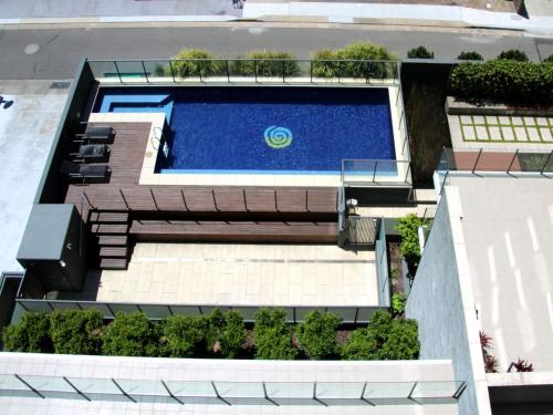 an overhead view of a swimming pool on a building at The Strand 602 in Forster