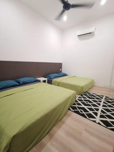 Postel nebo postele na pokoji v ubytování Wellson Home Ipoh 58 10px 全新链接式民宿有两间