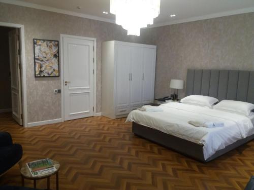 a large bedroom with a large bed in it at Termez Palace Hotel & Spa in Termiz