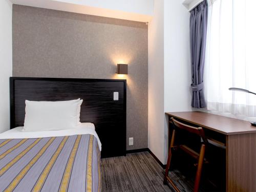Katil atau katil-katil dalam bilik di Hotel Koza