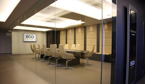a conference room with a table and chairs at Ego Hotel in Ancona