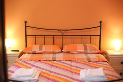 Katil atau katil-katil dalam bilik di B&B Il Tiglio