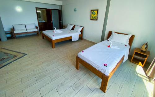 Postel nebo postele na pokoji v ubytování Orangea Beach Resort