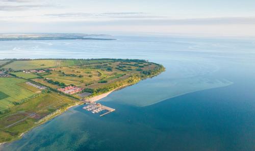 an island in the middle of a large body of water at Bades Huk Ferien-Resort in Hohenkirchen