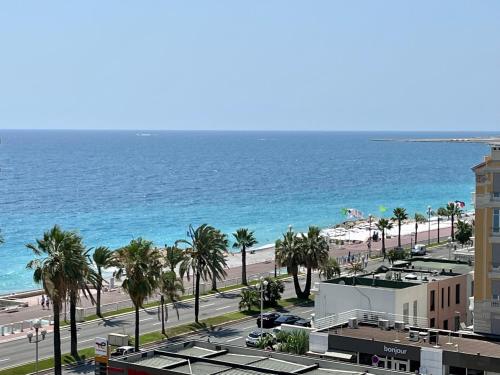 a view of the beach and the ocean from a building at 2 Bedrooms - Sea View Apartment in Nice