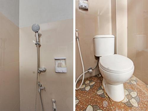 a bathroom with a toilet and a shower at OYO 91210 Hotel J3 in Lombok