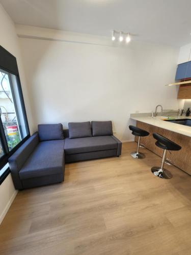 a living room with a couch and a table at cohen's house in Haifa