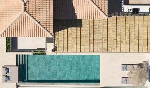 an aerial view of a house with a swimming pool at Epiphany Villas Lefkada in Tsoukaladhes