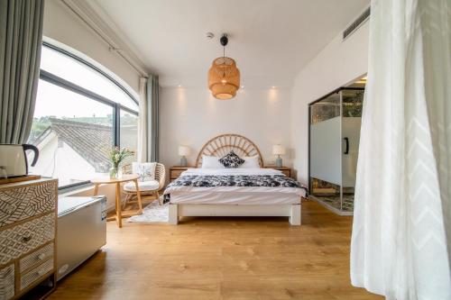 Katil atau katil-katil dalam bilik di Boke B&B Xihu