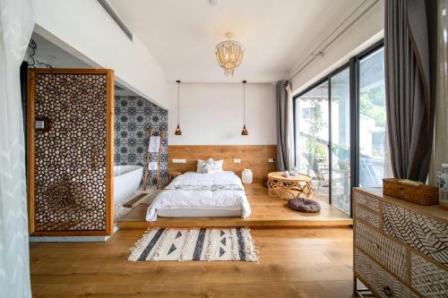 Katil atau katil-katil dalam bilik di Boke B&B Xihu