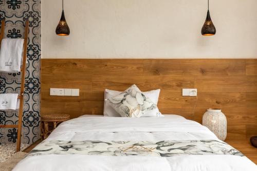 Katil atau katil-katil dalam bilik di Boke B&B Xihu