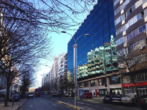 a city street with tall buildings and a street light at HI71 Lisboa in Lisbon