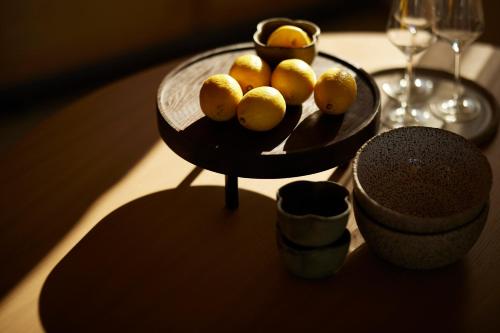 a tray with lemons on top of a table at Epiphany Villas Lefkada in Tsoukaladhes