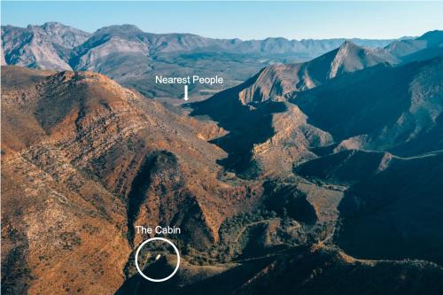 a view of the canyon from the sky with a map of mersumesp at Wolwehoek Private Reserve in Montagu