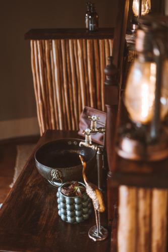 a wooden table with a sink in a room at Wolwehoek Private Reserve in Montagu