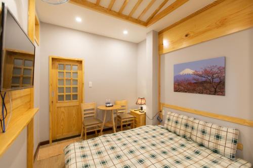 Postel nebo postele na pokoji v ubytování Nguyễn Tài Hostel & Coffee Đà Lạt