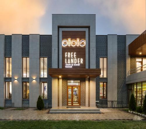 a building with a free lender sign on it at ololoFreelander Hostel&Coworking in Bishkek