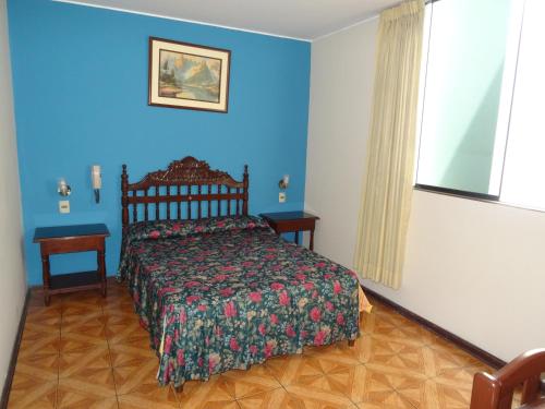 Een bed of bedden in een kamer bij Hotel Nova