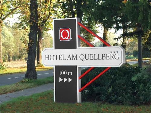 a sign for a hotel amuillesteensteensteensteensteensteensteensteen at Hotel Am Quellberg in Recklinghausen