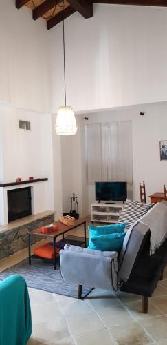 a living room with a couch and a table at Kalopanayiotis Museum Studio in Kalopanayiotis