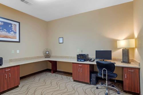an office with a desk with a computer and a chair at Best Western Texas City in Texas City