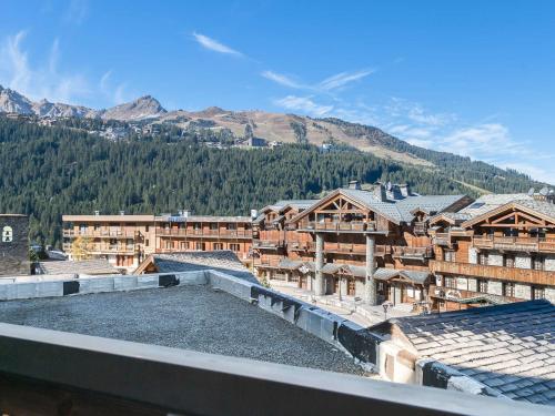 a view of a town with mountains in the background at Appartement Courchevel 1650, 2 pièces, 4 personnes - FR-1-563-82 in Courchevel