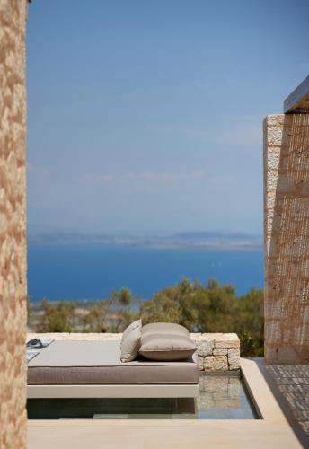 a bed sitting on top of avisor at Epiphany Villas Lefkada in Tsoukaladhes