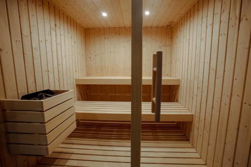 a sauna with wooden walls and a wooden floor at Solar do Requeijo by Luna Hotels & Resorts in Arcos de Valdevez