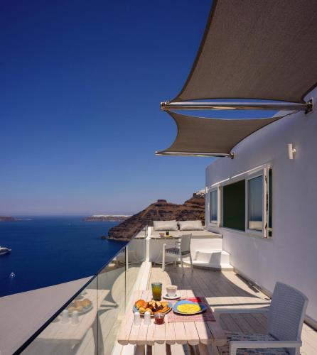 a house with a view of the ocean at Fira Deep Blue Suites in Fira