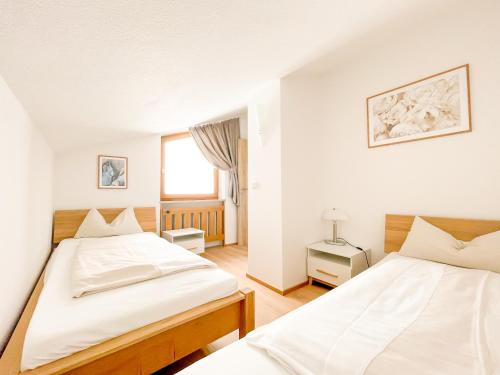 Ένα ή περισσότερα κρεβάτια σε δωμάτιο στο Yachthotel Chiemsee GmbH